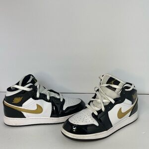 Jordan Kids Black, White, and Gold Sneakers